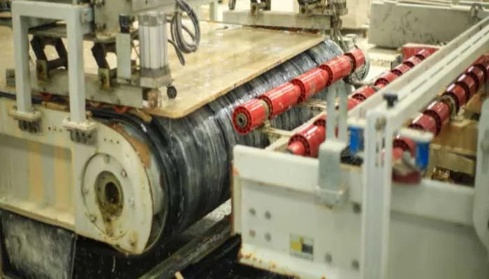 The multi-head automatic cut-to-size line with its row of red spindles