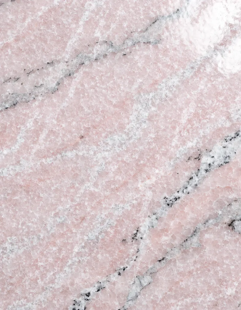 A polished slab of Rosa Sinai granite, pink with a fine crystalline sparkle