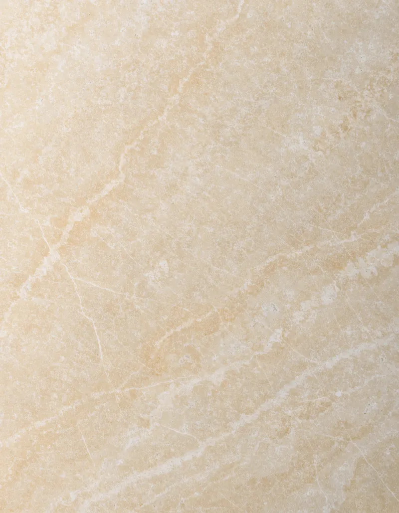 A polished slab of Golden Cream limestone, a warm golden ground with almost no veining